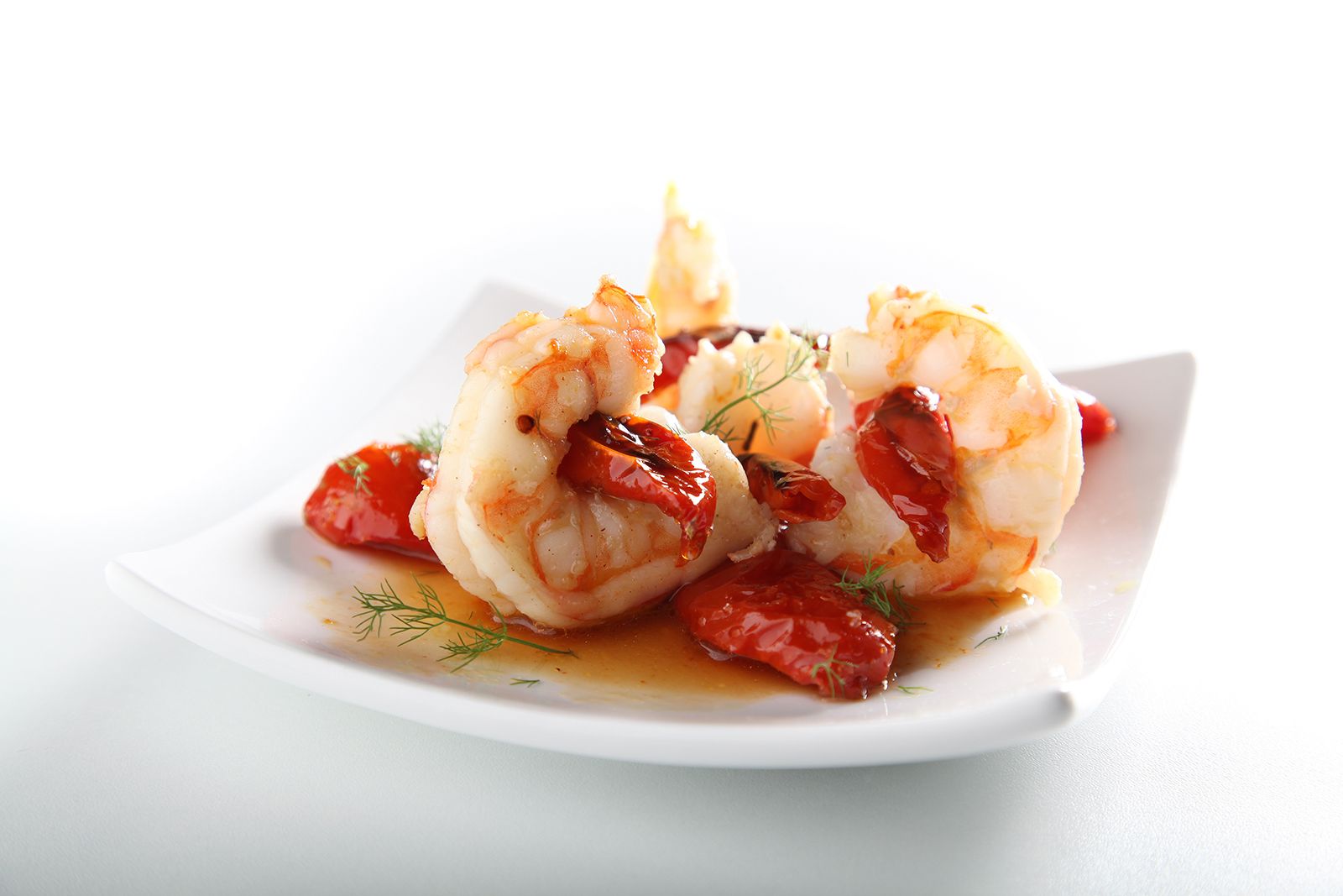 Orogel - Prawn tails with caramelized semi-dry cherry tomatoes flavored with thyme